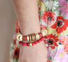 Woman wearing a chunky, warm-tone neutral bracelet handmade by artisans in Charlotte, NC, USA.