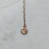Minimalist gold necklace with a gold-plated cross charm on an 18k gold-filled chain
