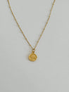 Minimalist gold necklace with a gold-plated daisy charm on an 18k gold-filled chain