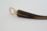 Branded bottle opener handmade from ethically-sourced cattle horn with gold hardware