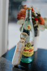 Rounded, branded bottle opener handmade from ethically-sourced cattle horn with gold hardware