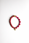 Hot pink and cranberry lightweight beaded bracelet handmade by artisans in Charlotte, NC, USA overcoming trauma and injustice.
