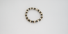 Jodi Black and Ivory Bracelet - Perfect for any occasion, the Jodi Black and Ivory Bracelet is neutral yet noticeable! Featuring black and ivory krobo beads, wood, and brass, this bracelet is for any occasion.