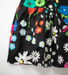 Black with colorful floral pattern.