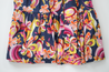 Navy with pink, orange, and yellow floral pattern.