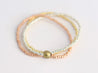 Gold, silver, and rose gold seed bead stretch tri-strand bracelet