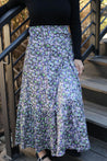 close up of the wrap skirt in purple, black, and green colors