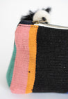 Small cosmetic bag handcrafted out of sheep's wool and Peruvian leather by indigenous artisans in Peru