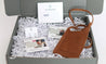 Gift set included a genuine leather phone crossbody bag with silver everyday hoop earrings and a $24 gift card to BraveWorks