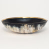 Elegant bowl handmade out of sustainably-sourced cattle horn, adorned with a brass inner rim