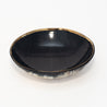 Elegant bowl handmade out of sustainably-sourced cattle horn, adorned with a brass inner rim