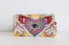 Multicolor travel pouch with heart, birds, and eye