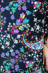 Festive wrap skirt with black background and colorful paisley and floral pattern sewn in the USA