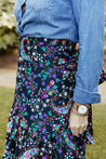 Festive wrap skirt with black background and colorful paisley and floral pattern sewn in the USA