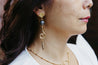 Handmade dangle earrings with gold-plated topper and swirl connector, featuring Abalone semi-precious gemstone beads 