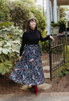 Festive wrap skirt with black background and colorful paisley and floral pattern sewn in the USA