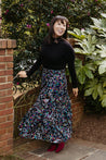 Festive wrap skirt with black background and colorful paisley and floral pattern sewn in the USA