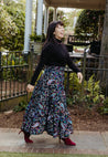 Festive wrap skirt with black background and colorful paisley and floral pattern sewn in the USA