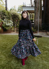 Festive wrap skirt with black background and colorful paisley and floral pattern sewn in the USA