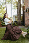 100% cotton wrap brown skirt with subtly brown floral pattern sewn in the USA