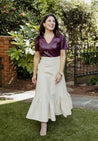 Textured 100% cotton, cream-colored wrap skirt with one tier at the bottom sewn in the USA