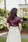 Textured 100% cotton, cream-colored wrap skirt with one tier at the bottom sewn in the USA
