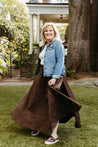 100% cotton wrap brown skirt with subtly brown floral pattern sewn in the USA