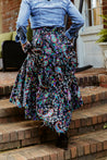 Festive wrap skirt with black background and colorful paisley and floral pattern sewn in the USA
