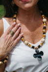 Gold, cream, and black chunky necklace.