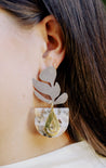 Statement dangle silver and gold earrings handmade by artisans in Charlotte, NC