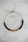 black and gold beaded collar necklace on brass cord