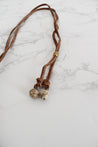 End of handmade long leather cord necklace