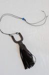 Adjustable cord necklace with cattle horn pendant and genuine leather tassel
