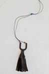 Adjustable cord necklace with cattle horn pendant and genuine leather tassel