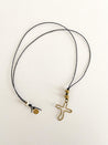 Handmade cotton cord long necklace with a textured brass cross pendant