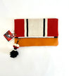 Foldover clutch bag handcrafted out of sheep's wool and leather by artisans in Peru