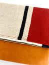 Foldover clutch bag handcrafted out of sheep's wool and leather by artisans in Peru