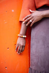 Orange and cream braclet with a floral focus bead