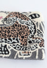 Gray, tan, black, and white tapestry clutch/crossbody with leopard design