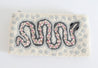 Pink, gray, light blue, and white tapestry pouch
