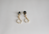 Feminine dangle earrings with two types of pearl beads and a resin topper