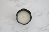 Hand-poured soy candle in a cattle horn vessel