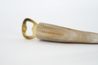 Branded bottle opener handmade from ethically-sourced cattle horn with gold hardware