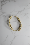 Neutral, minimalist bracelet with a timeless, lightweight style handmade by artisans in Charlotte, NC, USA.