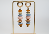 Chunky dangle earrings with soft pastel colors, featuring Ashanti prayer and recycled glass beads.