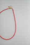 Lightweight and minimalist pink necklace, handmade out of seed beads by artisans overcoming trauma and injustice in Charlotte, NC. 