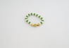 Add a pop of color to your wardrobe with the Leeda Flower Bracelet. This playful piece features a mix of metal, glass, and agate gemstones in shades of green, yellow, and white, reminiscent of a spring meadow