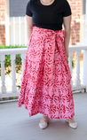 3-tiered wrap skirt. Bright pink with meroon sun pattern.