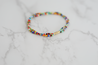 Minimal bracelet with primary colored beads.