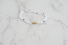 Minimal bracelet with blue and white colored beads.